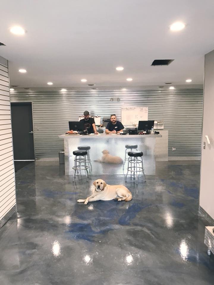The Lake Orion Truck Accessories showroom with the shop dog